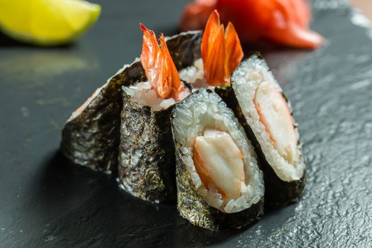 japanese cuisine. Rolls with shrimp on the black background