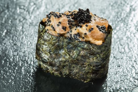 Japanese Cuisine - Sushi Roll with Tuna, Salmon, Conger and Flying Fish Roe