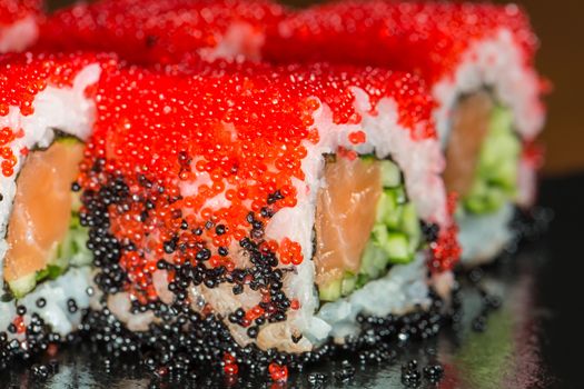 Japanese Cuisine - Sushi Roll with Tuna, Salmon, Conger and Flying Fish Roe