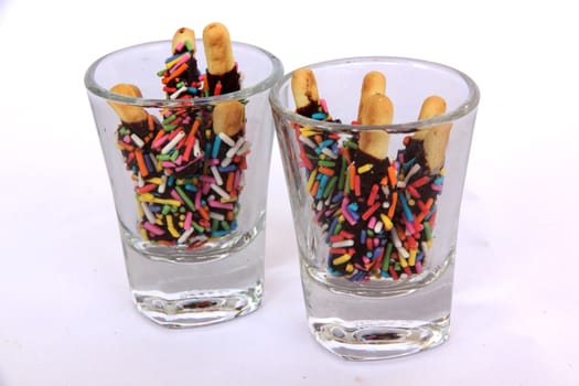 snack chocolate in glass cup sprinkled with sugar color