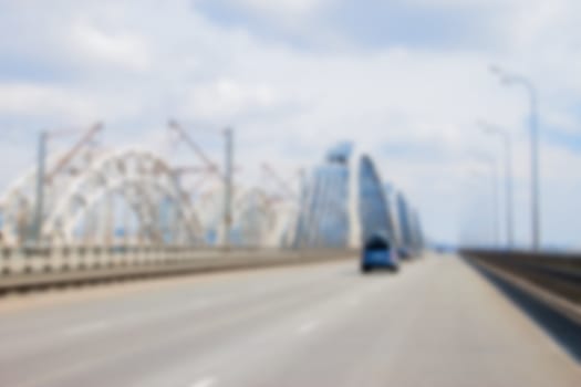 blurred car driving to the horizon on bridge