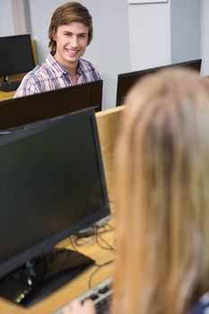 Students working together on computers at the university