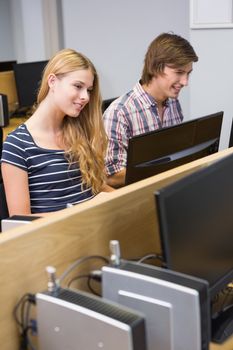 Students working together on computers at the university