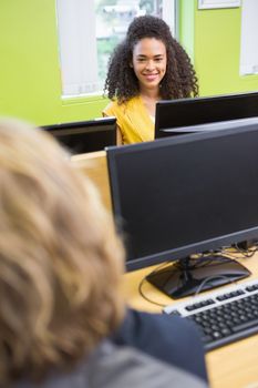 Student working on computer in classroom at the university