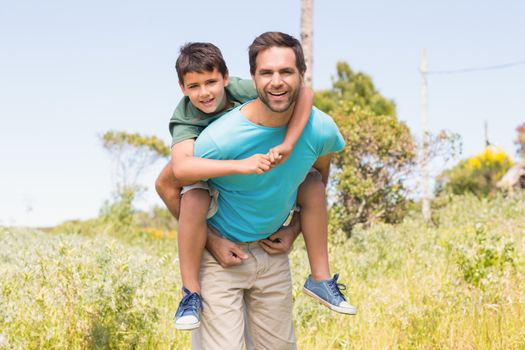 Father and son in the countryside on a sunny day