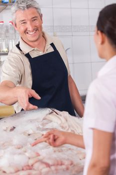 Happy seller of fish