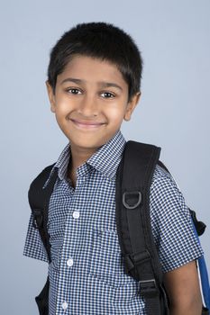 Handsome Indian toddler ready to go to school