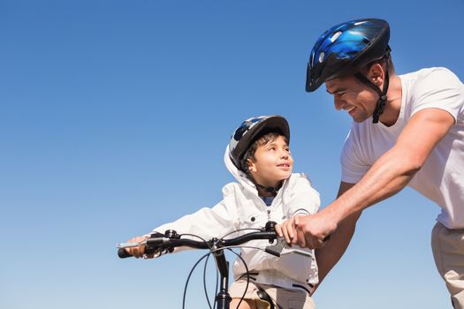 Father and son on a bike ride on a sunny day