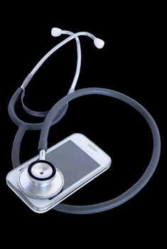 Telephone and stethoscope on isolate black background