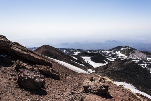 Etna mountain landscape, volcanic rock and snow, Sicily, Italy