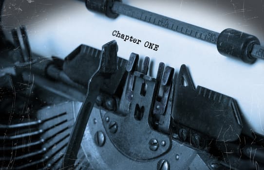 Close-up of an old typewriter with paper, perspective, selective focus, chapter one