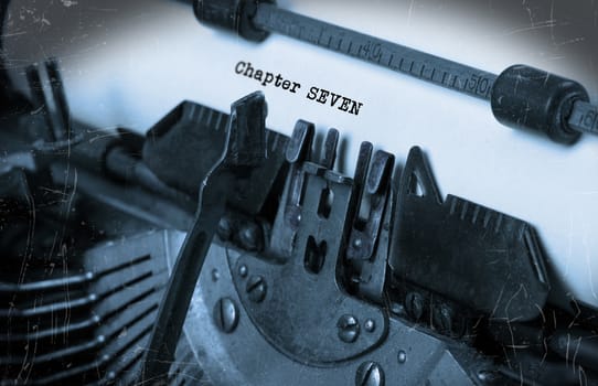 Close-up of an old typewriter with paper, perspective, selective focus, chapter seven