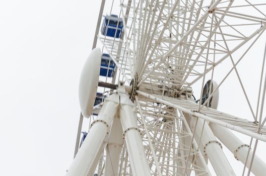 View from below of the construction of a ferris wheel.