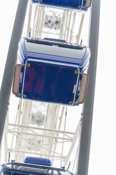 View from below of the construction of a ferris wheel.