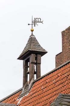 Church tower with blue cloudy sky.