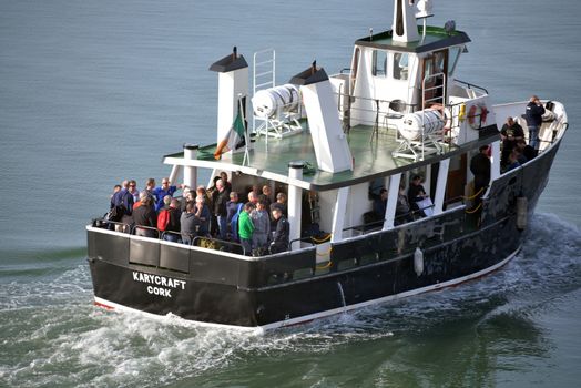 passengers departing from cobh on a ferry boat