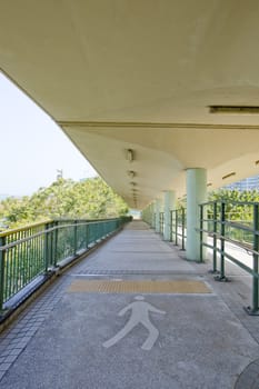 walkway with a metal handrail.