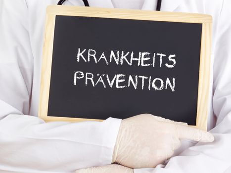 Doctor shows information: preventive healthcare in german
