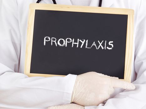 Doctor shows information on blackboard: prophylaxis