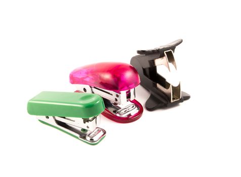 two stapler and staple remover isolated on white background