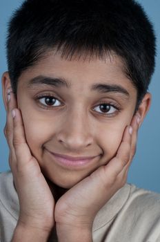 Portrait of an handsome young indian kid smiling 