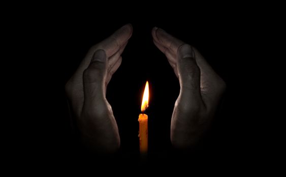 Candle light in hand, Hope concept