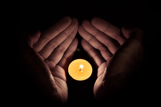 Candle in the hand, Hope and pray concept