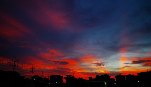 Nice sunset light shine on the sky with city silhouette