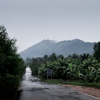 Wet road with raining sky