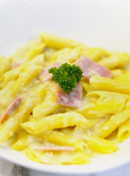 Penne spaghetti carbonara with ham