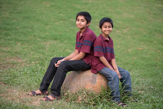 Handsome Indian toddler standing outdoor smiling