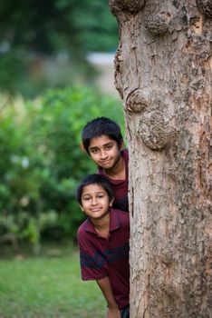 Handsome Indian toddler standing outdoor smiling