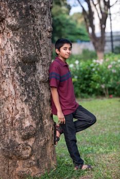 Handsome Indian toddler standing outdoor smiling