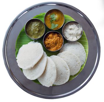 Idli and sambar isolated on white background.  South Indian Snack