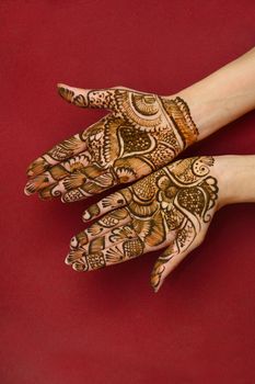 beautifully decorated indian hands with mehandi typically done for weddings