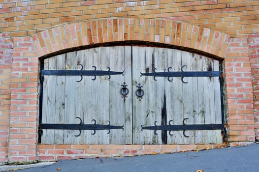 Old wooden barn door in village