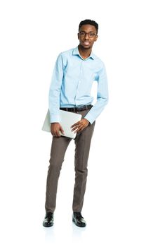 Happy african american college student with laptop standing on white background