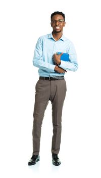 Happy african american college student with books in his hands standing on white background