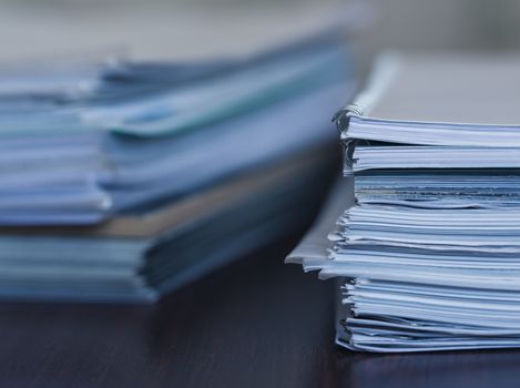 Accounting and taxes. Large pile of magazine and books closeup