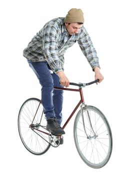 Young man doing tricks on a bicycle on a white background