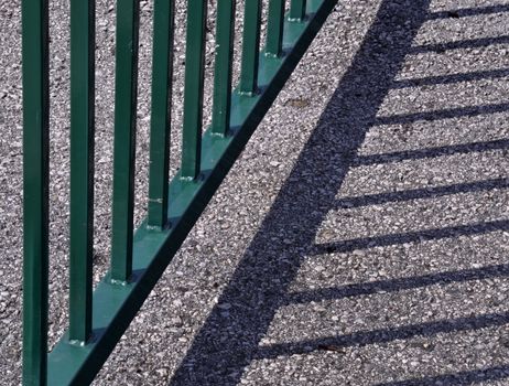 abstract background shadow railing on the sidewalk