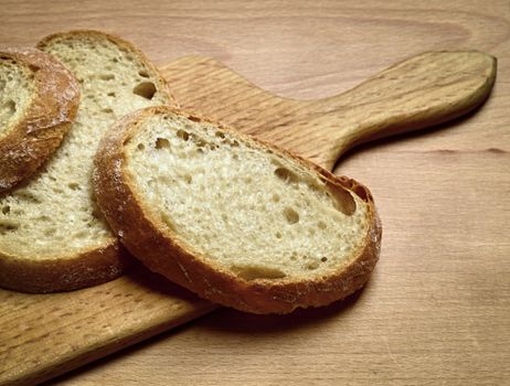 still life with sliced bread on a cutting board