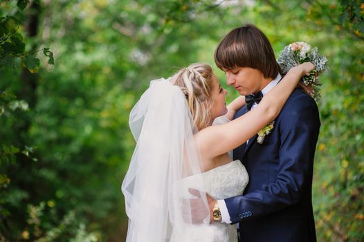 bride and groom for a walk in the park.