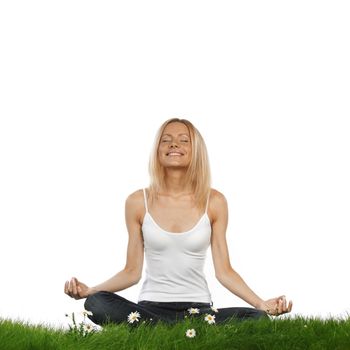 Yoga woman on green grass in lotus pose, isolated on white background