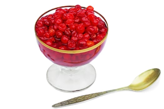 Bright red berries in a crystal vase filled with sugar syrup. Presented on a white background.