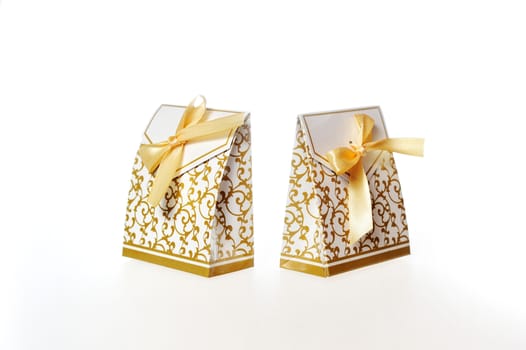 White Gift Box with Gold Ribbon Isolated on a White Background.