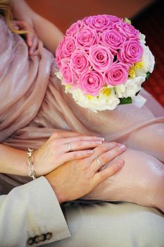 hands of the bride and groom together