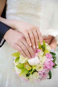 hands of the bride and groom together