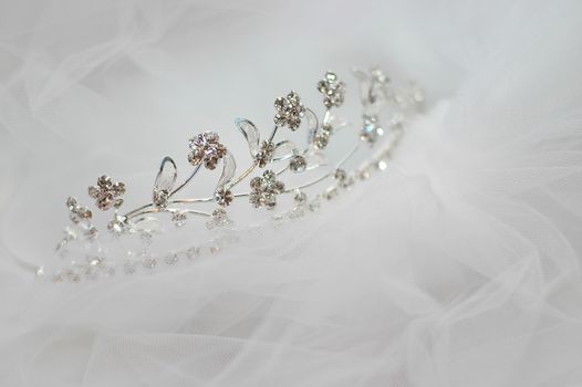 wedding bride tiara lying on a white veil