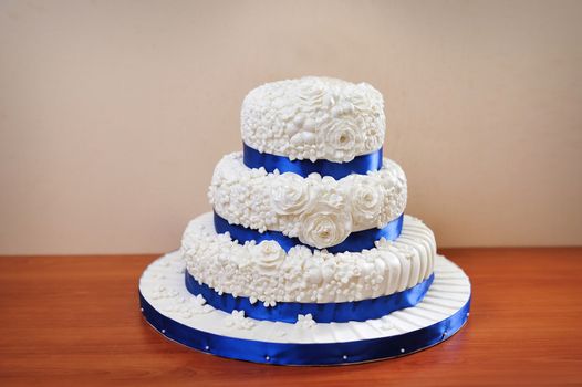 multi tiered wedding celebration cake with sugar flowers